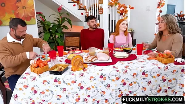 This Thanksgiving horny redhead stepsisters Arietta Adams and Cherry Fae fuck their stepbrother in the living room, while their stepdad fucks their stepmom in the dining room.