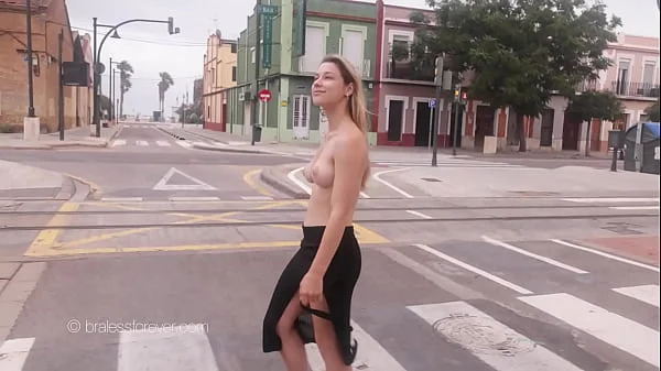 Stunning girl topless in the streets at sunrise