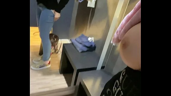 Secretly pussy fingered to orgasm in shopping center dressing room