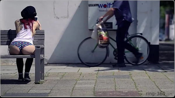 Brunette girl with skateboard flashing in public