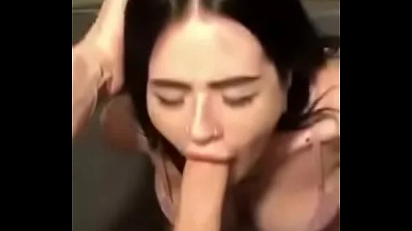 Submissive brunette sucking a giant cock