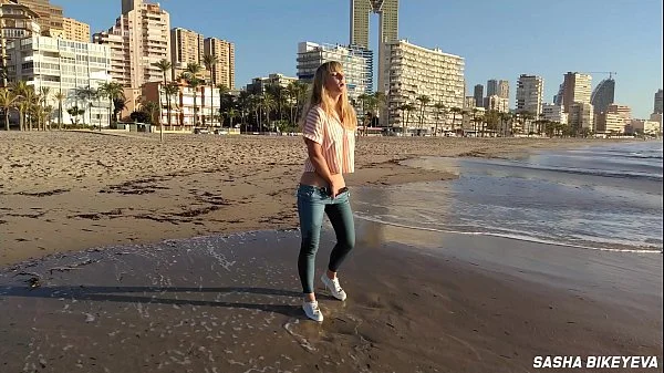 Wet shoot on a public beach with Crazy Model. Risky outdoor masturbation. Foot fetish. Pee in jeans.