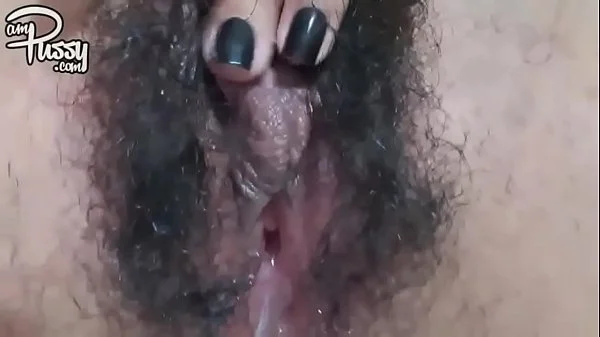 Extreme close-up hairy pussy masturbation