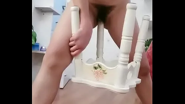 Chinese girl using chair legs as dildo