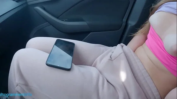 Teen masturbates on a public car park watching her porn video - ProgrammersWife